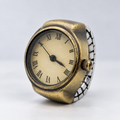 Patina Patina Antique Gold — Roman on pale grey studio background